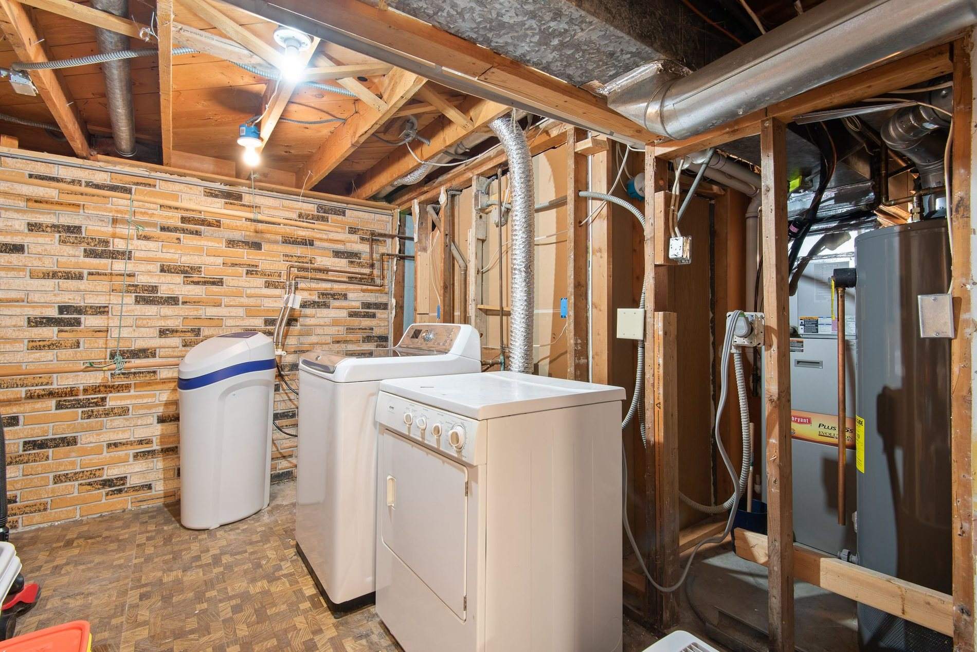 Basement mechanical area of a home, the space a sump pit and pump keep dry