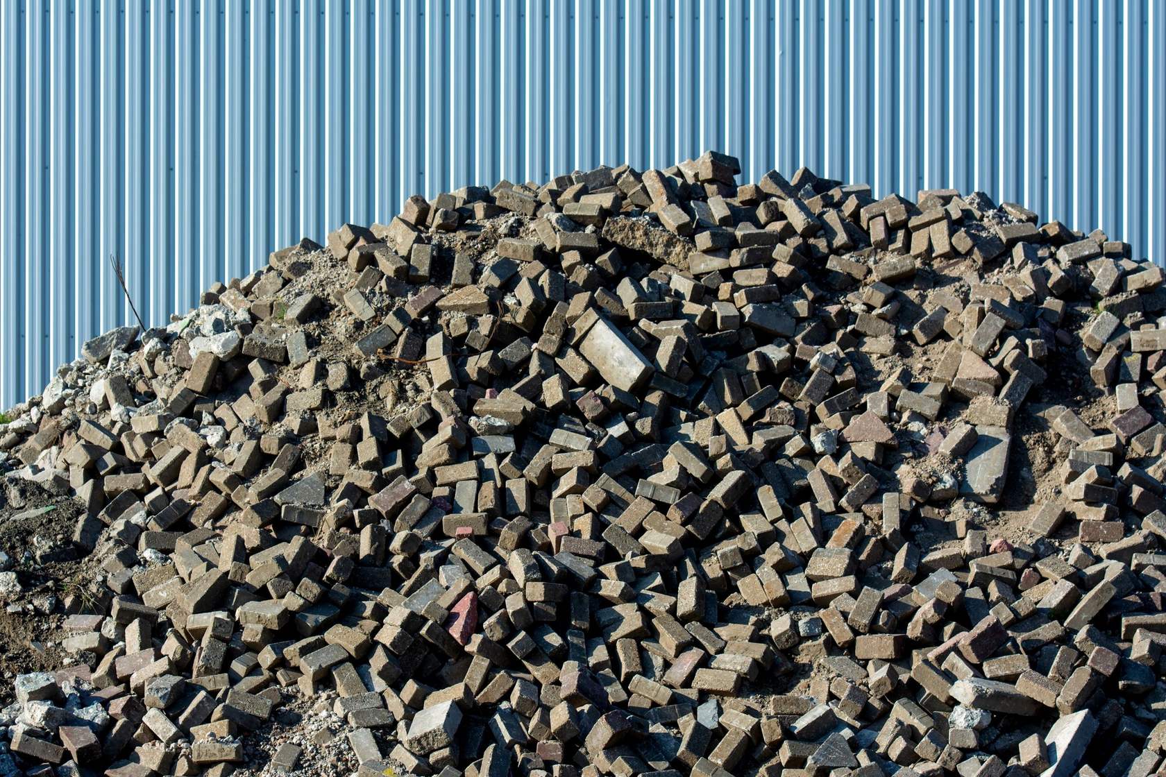 A heap of broken brick and concrete after a demolition