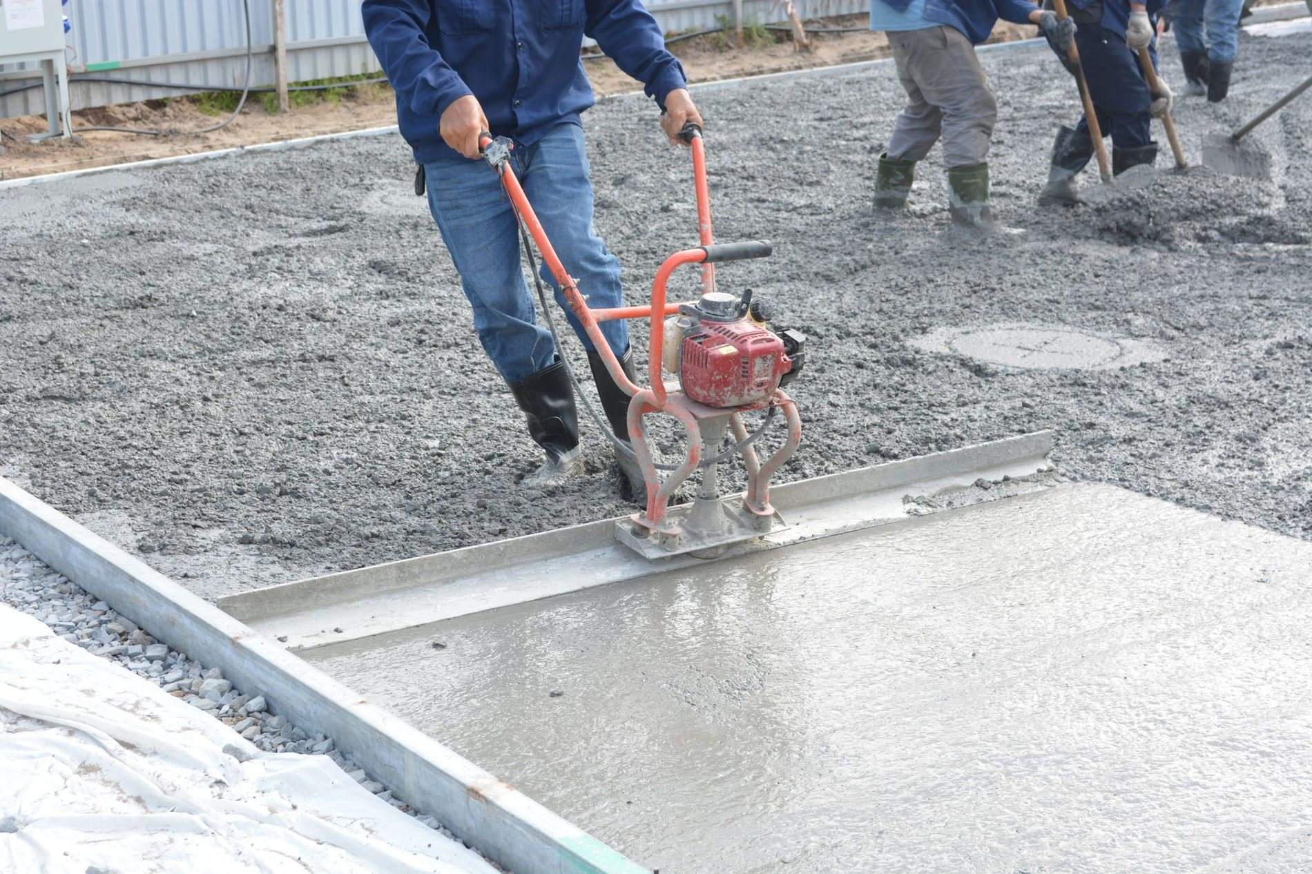 Fresh concrete being finished on a slab
