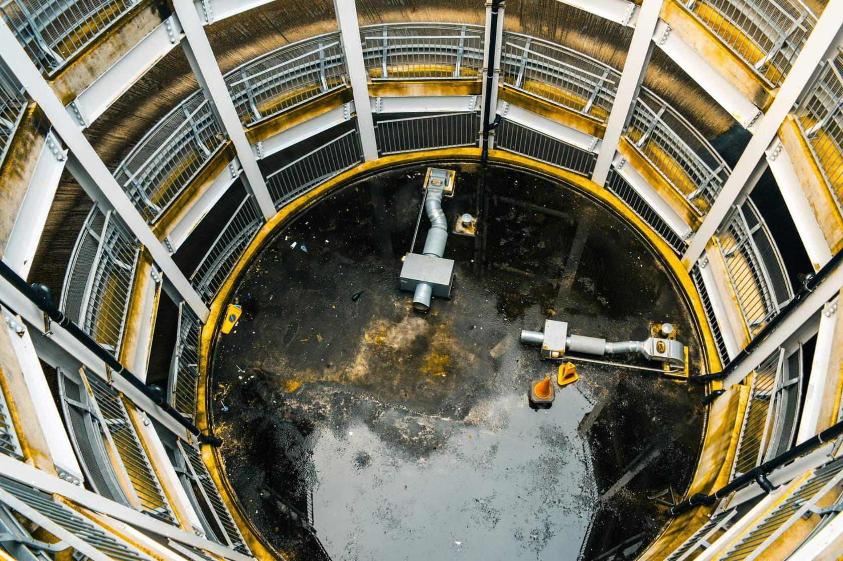 Looking down a manhole shaft into a sewer structure