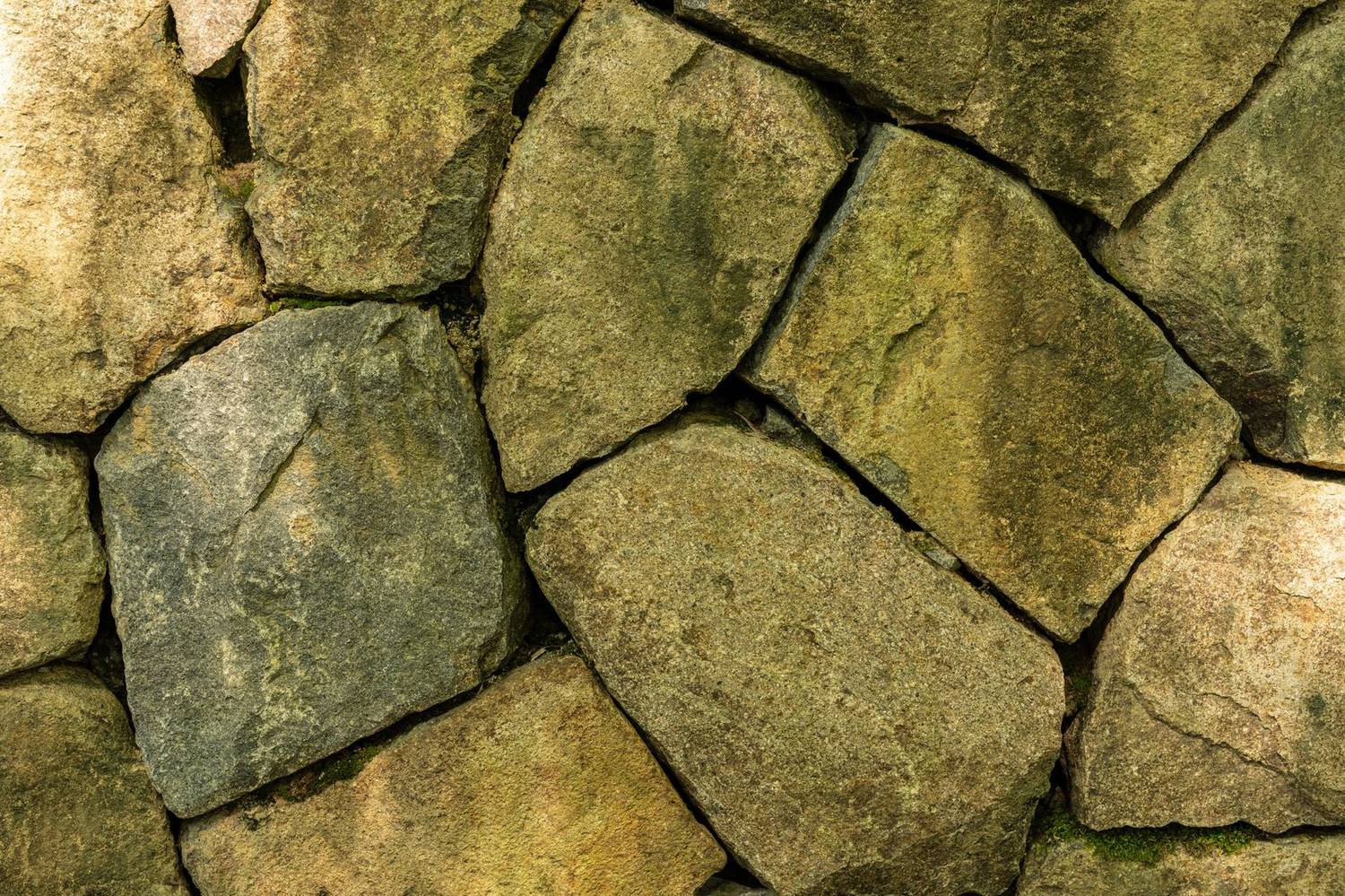 A retaining wall built from large stone blocks